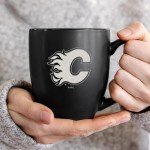 Rico Industries NHL Hockey Calgary Flames 15oz Laser Engraved Matte Black Ceramic Bistro Mug - For Hot or Cold Drinks