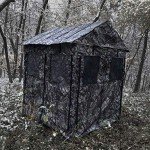 BACKYARD EXPRESSIONS PATIO · HOME · GARDEN Deluxe Steel Frame True Timber® Camo 3 or 4 Person Hunting Ground Blind - (8) Shoot Through Mesh Windows and Anchoring System Included