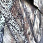 BACKYARD EXPRESSIONS PATIO · HOME · GARDEN Deluxe Steel Frame True Timber® Camo 3 or 4 Person Hunting Ground Blind - (8) Shoot Through Mesh Windows and Anchoring System Included