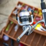 Zebco Spyn Spinning Fishing Reel, Size 20 Reel, Aluminum Spool, Super Tough Titanium-Nitride Plated Bail Wire, 5.3:1 Gear Ratio, Pre-Spooled with 8-Pound Zebco Line, Silver/Black