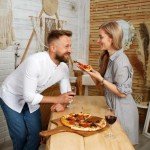 16" Wooden Pizza Peel by KitchenStar - Premium Acacia Wood Paddle Spatula for Oven, Large - Food Oil Processed Serving Board w Hanging Loop - Pizza Oven Accessories