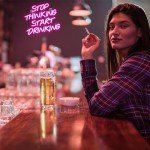 Pink Neon "Stop Thinking, Start Drinking" Sign