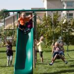 Monkey Bar Adventure Swing Set with Wavy Slide