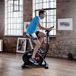 Reebok GB40s Stationary Bike: Bluetooth Compatible Indoor Cycling Bike, 32 Resistance Levels, 12 Workouts, Adjustable Saddle, Upright Exercise Bike.