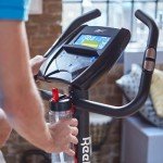 Reebok GB40s Stationary Bike: Bluetooth Compatible Indoor Cycling Bike, 32 Resistance Levels, 12 Workouts, Adjustable Saddle, Upright Exercise Bike.