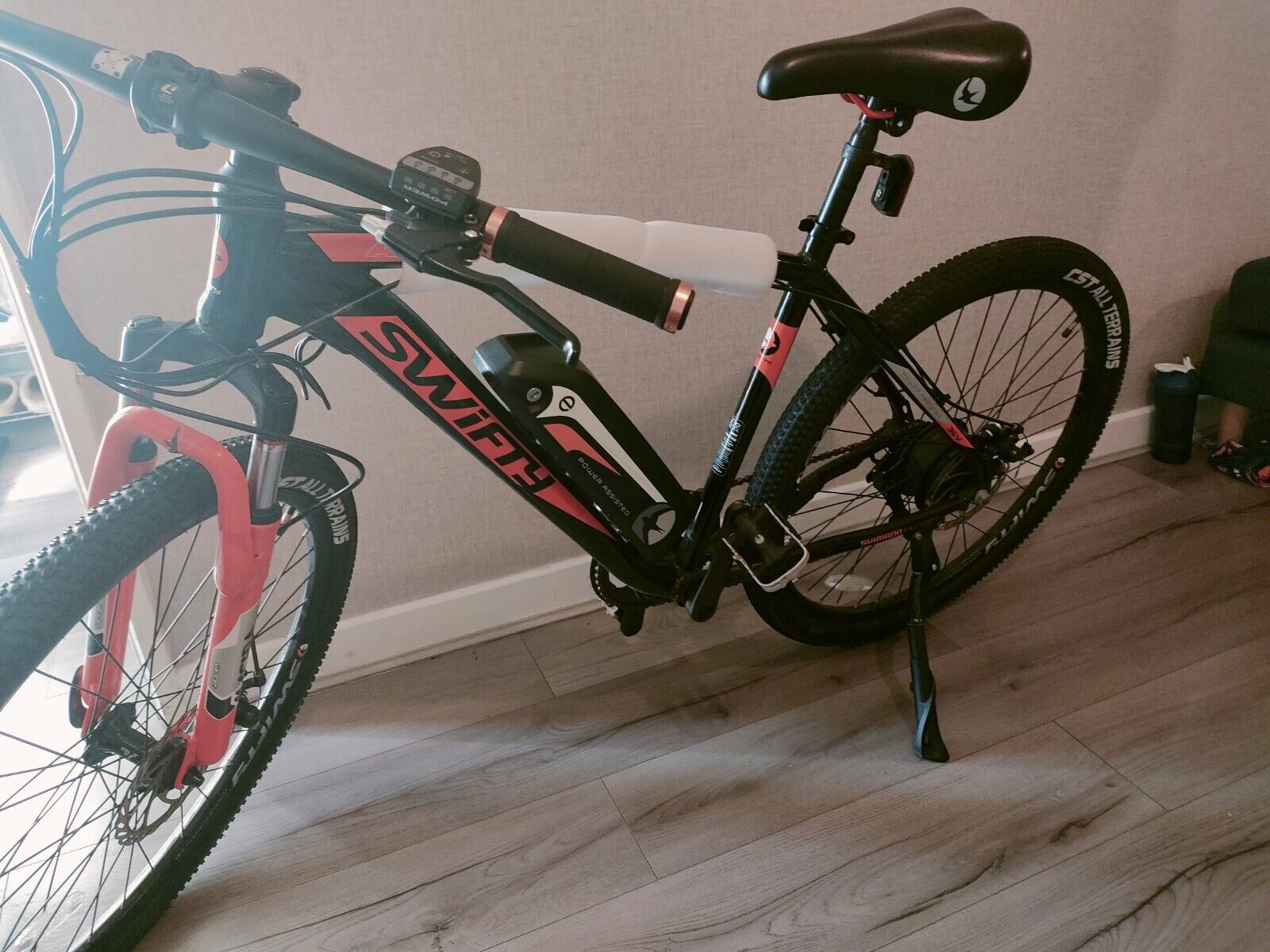 Black and Orange Swifty Electric Mountain Bike