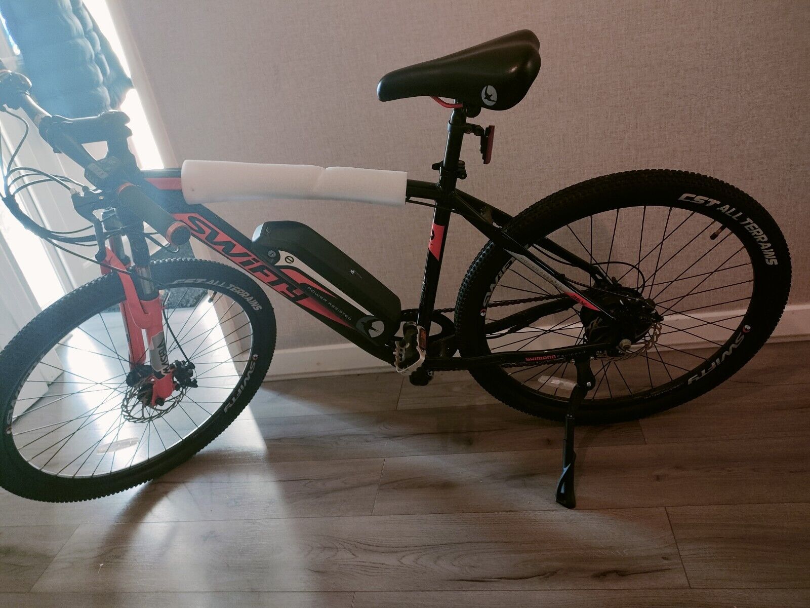 Black and Orange Swifty Electric Mountain Bike