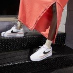 Nike Women's Sneakers in White and Orange