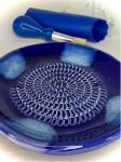 BonCera, All-in-one Premium Ceramic Garlic Grater Plate 4-Piece Set - Blue Cross Glazed Design and Style - For Garlic, Ginger, Chocolate, and more! - Comes with 5.25" Plate, Peeler, Brush, and Stand