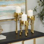 CosmoLiving by Cosmopolitan Aluminum Pillar Candle Holder with Dripping Melting Designed Legs, Set of 3 12", 10", 8"H, Gold