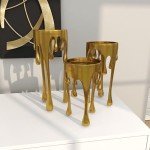 CosmoLiving by Cosmopolitan Aluminum Pillar Candle Holder with Dripping Melting Designed Legs, Set of 3 12", 10", 8"H, Gold