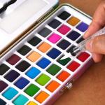POTTREATIVE 50 Colors Watercolor Paint Set - Vibrant Pigments in Portable Metal Case with 6 Brushes, Non-Toxic Travel-Friendly Painting Kit for Professional Artists/Students/Beginners