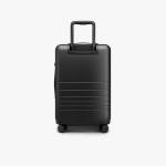 Monos Carry-On Pro Plus Luggage (23"), Hardside Spinner Suitcase with TSA Lock & Front Pocket, Airline Approved, Midnight Black