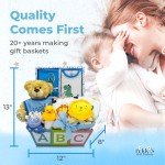 Deluxe 15-Piece New Baby Gift Basket | Newborn Baby Boy Gift Set with Baby Essentials | Baby Gift Basket for Expecting Moms & Parents | Blue Baby Gift Set with Dinosaurs | Nikki's Gift Baskets