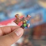 Springbok's Winter Wonderland Cafe 500 Piece Jigsaw Puzzle is a Picturesque Holiday Scene of a Cosy Cafe in The City