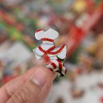 Springbok's Christmas Boutique 1000 Piece Jigsaw Puzzleby Artist Gina Jane Features a Cozy Holiday Boutique Overflowing with Festive Gifts