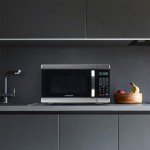 Farberware Countertop Microwave 1000 Watts, 1.1 Cu. Ft. - Microwave Oven With LED Lighting and Child Lock - Perfect for Apartments and Dorms - Easy Clean Stainless Steel