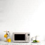 Haden 700 Watt 0.7 Cubic Foot Microwave Oven with Digital Controls, Defrost, and Instant Start Countertop Small Appliance, Putty/Chrome