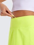 CRZ YOGA Womens Pleated Tennis Skirts with Pockets High Waisted Athletic Golf Skorts for Women Soft Breathable Cute Neon Yellow Medium
