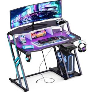 MOTPK Gaming Desk with Power Outlet & LED Lights, Gaming Computer Desk 39inch with PC Storage Shelf, Gaming Table with Carbon Fiber Texture, Gamer Desk, Gift for Boys Men, Black