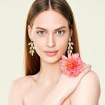 Gold Leaf Dangle Earrings with Floral Design