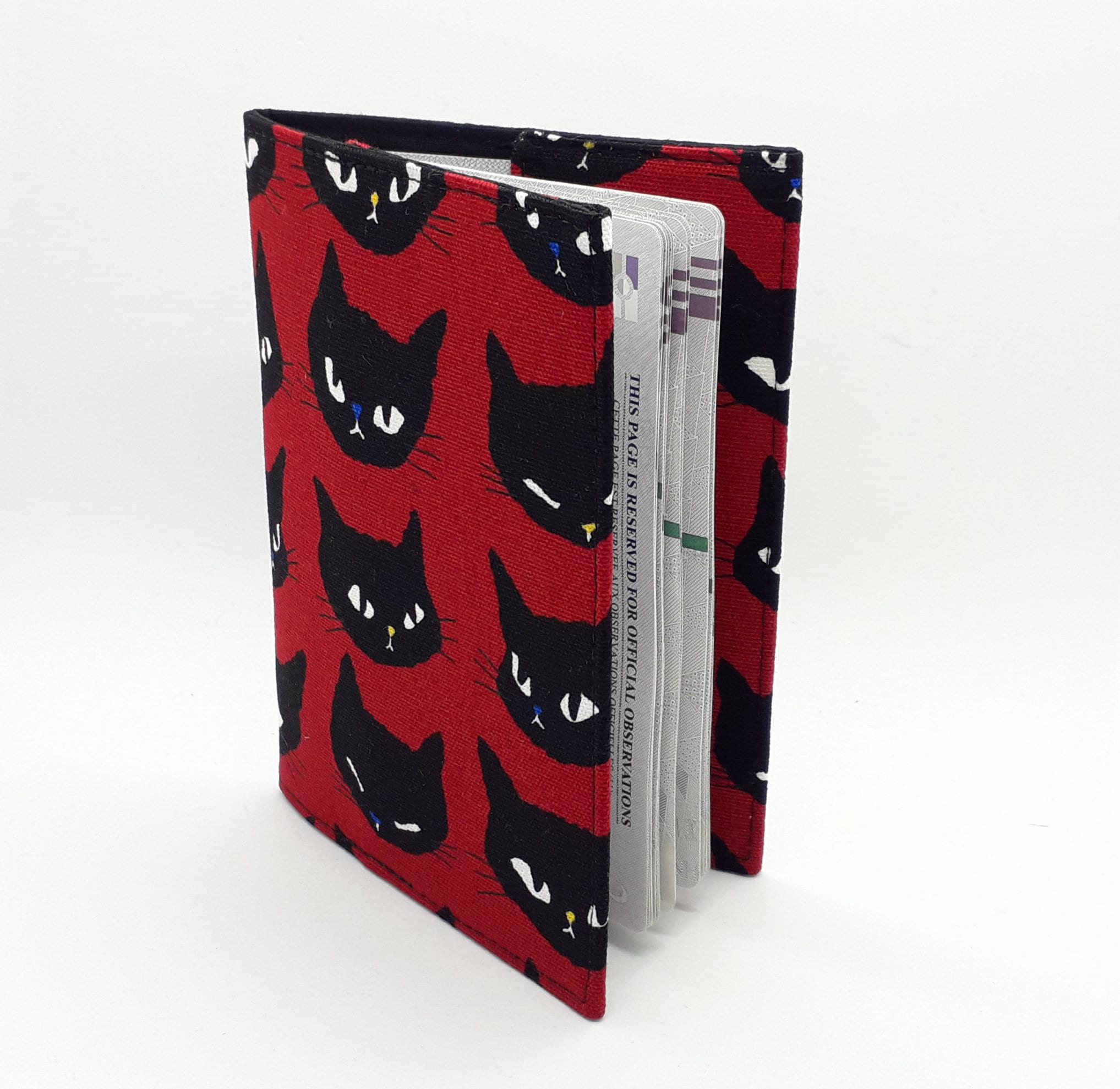 Cat-themed travel essentials in red & black