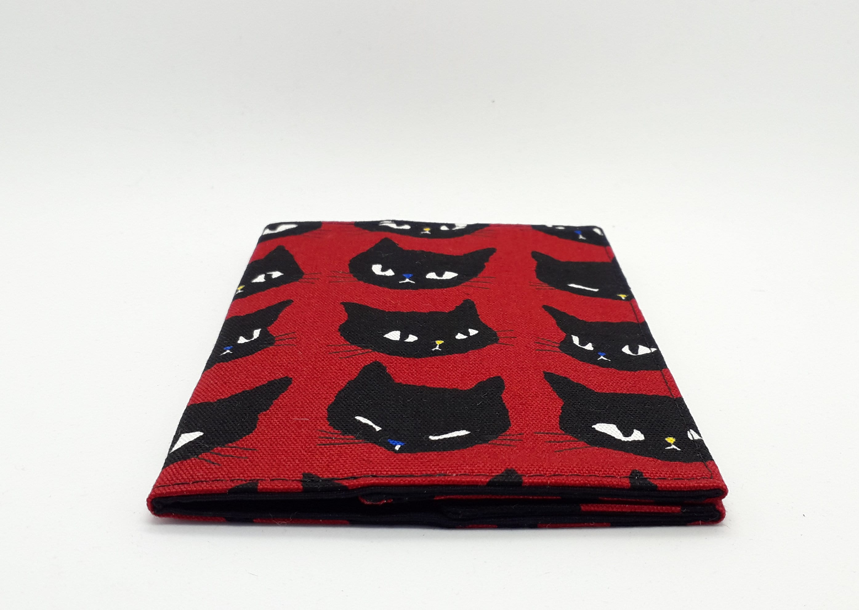 Cat-themed travel essentials in red & black