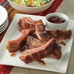 Premium Hickory-Smoked Pork Baby Back Ribs - Hand-Rubbed, Fully Cooked, and Bursting with Flavor. Barbecue Tradition. 6 Slabs without Barbecue Sauce from Kansas City Steak Company.