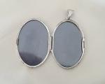 Vintage Oval Silver Photo Locket with Floral Design