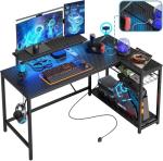 Bestier 132.5CM L-Shaped Workstation with Carbon Fibre Surface, 3 Power Outlets & 2 USB Ports, LED Strip Lights – Reversible Corner Unit with Shelves & Hooks for Home Office & Gaming
