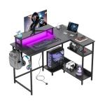DEVAISE L Shaped Gaming Desk with Power Outlets & RGB LED Lights, 111CM Gaming Desk with Monitor Stand & Hook, Corner Desks with Storage Shelf for Home Office & Small Spaces, Black