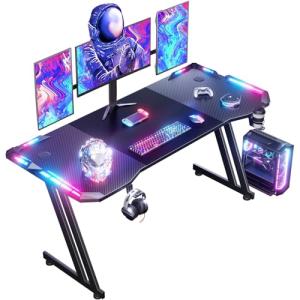DLONGONE 160 x 60 cm RGB Gaming Desk, Gaming Table for Laptop, Home Office Desk with Carbon Fiber Coated, Gaming PC Table with Headphone Hook and Cup Holder, Easy to Assemble, Black