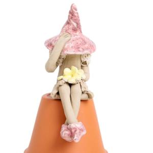 Shy fairy, fairy garden pottery fairy figurine, pixie plant pot ornament, holding a posy of yellow flowers.