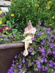 Shy fairy, fairy garden pottery fairy figurine, pixie plant pot ornament, holding a posy of yellow flowers.