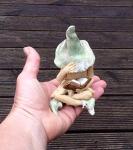 Shy fairy, hand made fairy garden pottery fairy, reading her book, light green, cross legged
