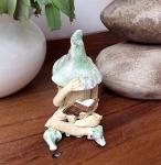 Shy fairy, hand made fairy garden pottery fairy, reading her book, light green, cross legged