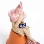 Fairy garden fairy, ceramic plant pot ornament, outdoor indoor figurine, pink hat, holding a blue butterfly.