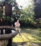 Fairy garden fairy, ceramic plant pot ornament, outdoor indoor figurine, pink hat, holding a blue butterfly.