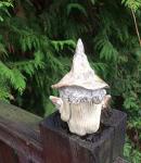 Fairy garden boy shy fairy figurine, pixie plant pot ornament, holding a ladybird, brown hat and boots.