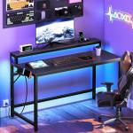 YATINEY 47.2" Computer Desk with Charging Station and LED Lights, Gaming Desk with Monitor Stand, 2-Tier Home Office Desk with 4 Side Hooks, for Living Room, Home Office, Black DN12UDBB