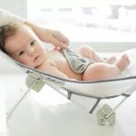 The First Years Sure Comfort Folding Baby Bather - Foldable Baby Bath Seat and Lounger for Home or On the Go - for Sink or Tub Use - Non-Slip Seat - For Up to 15 Lbs