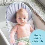The First Years Sure Comfort Folding Baby Bather - Foldable Baby Bath Seat and Lounger for Home or On the Go - for Sink or Tub Use - Non-Slip Seat - For Up to 15 Lbs