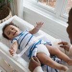 Ingenuity Contoured Changing Pad – Includes Waterproof Changing Liner and Safety Fastening Strap with Quick-Release Buckle