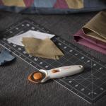 Fiskars 45mm Rotary Cutter for Fabric, Premium Steel Stick Fabric Cutter Cuts Through Multiple Layers, Right and Left Handed, Easy and Safe Blade Change, Arts and Crafts, Sewing and Quilting Tools