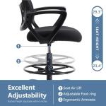 HAPPYMONT Tall Drafting Desk Chair - Ergonomic High Stool Computer with Adjustable Height and Comfy Lumbar Support, Office Rolling Counter with Flixed Arms and Footrest, Dark Black