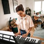 AQNIEGEP 61 Key Electric Keyboard Piano for Beginners w/Light-Up Keys, Christmas Gifts, Full Set: Stand, Bench, Headphones, Padded Bag, Note Stickers, 70 Demos, 200 Rhythms/Tones, LED Display