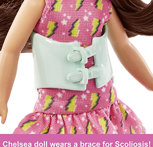 Barbie Toys, Chelsea Doll, 6-Inch Small Doll with Brace for Scoliosis Spine Curvature, Brunette Wearing Pink Lightning Bolt Dress by Mattel