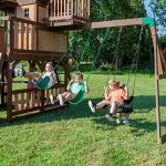 Backyard Discovery Skyfort All Cedar Swing Set, Elevated Covered Wood Roof Clubhouse with Bay Windows, 2 Belt Swings, Web Swing, 10ft Wave Slide, 5 ft Tube Slide, Covered Picnic Table, 5 ft Rock Wall from Backyard Discovery