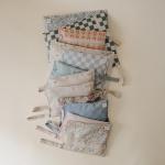 mushie Water Resistant Wet Bags | Large & Small Reusable Storage Bag for Baby Items and Travel | Zippered Pockets with Handle | Machine Washable, Set of 2 (Pastel Blooms)