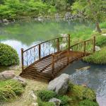 Outsunny 7' Metal Arch Garden Bridge with Safety Siderails, Decorative Arc Footbridge with Delicate Scrollwork S Motifs for Backyard Creek, Stream, Fish Pond, Bronze